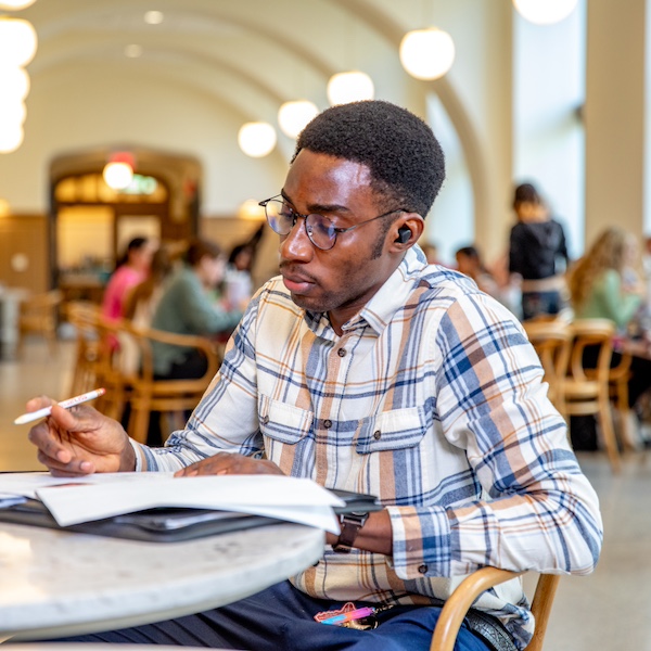 Uark student studying in The Cord on campus